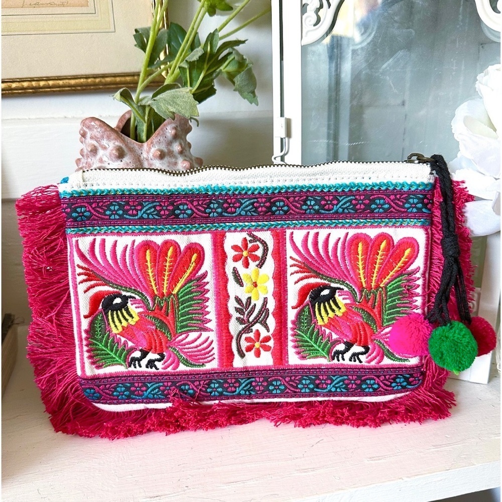 Limited Edition Embroidered Fringe Clutch features a vibrant boho pattern